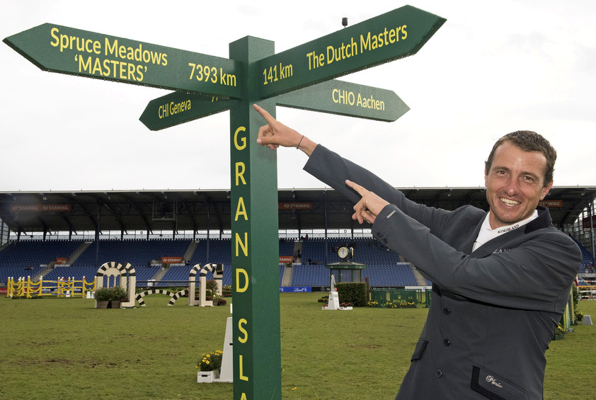 Gregory Whatelet with the Rolex Grand Slam signpost