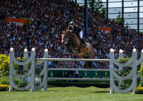 Richard Vogel (GER) in competition with United Touch S in the Rolex Grand Prix