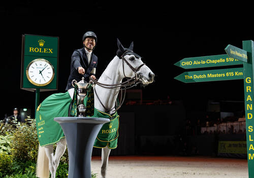 Kent Farrington (USA) celebrates winning the Rolex Grand Prix with Greya alongside the Rolex Grand Prix trophy