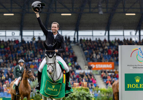 Martin Fuchs (SUI) rides Conner Jei as he makes his way out