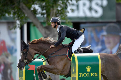Steve Guerdat (SUI) und ALBFUEHRENS HAPPINESS. Das Bild darf nur im Zusammenhang mit der Pressemitteilung verwendet werden. Bild: Rolex Grand Slam of Show Jumping/Kit Houghton).