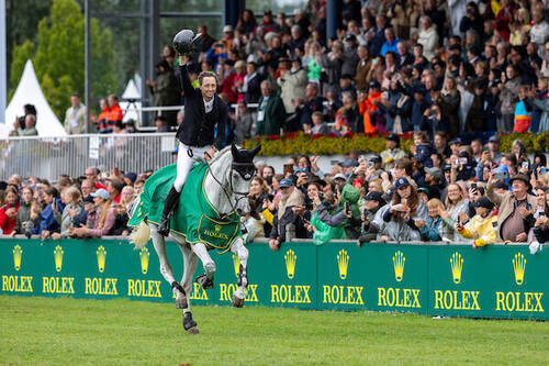 Martin Fuchs (SUI) rides Leone Jei as he celebrates winning the Rolex Grand Prix