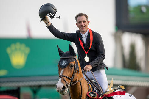 Scott Brash (GBR) riding Hello Jefferson walks a lap of honour as they celebrate winning the CPKC 'International' Grand Prix, presented by Rolex