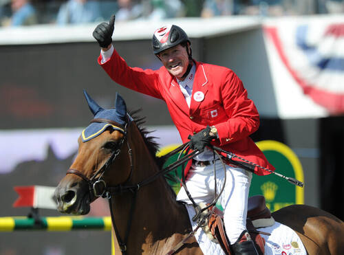 Ian Millar of CAN riding Dixson during the CP International Prix at the Spruce Meadows 'Masters' 2014.